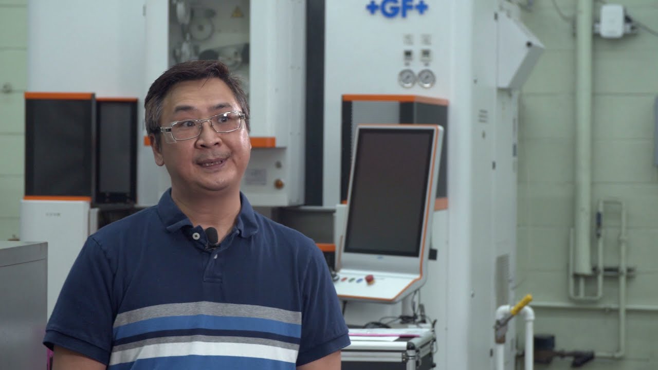 S&C employee wearing safety glasses in a manufacturing room